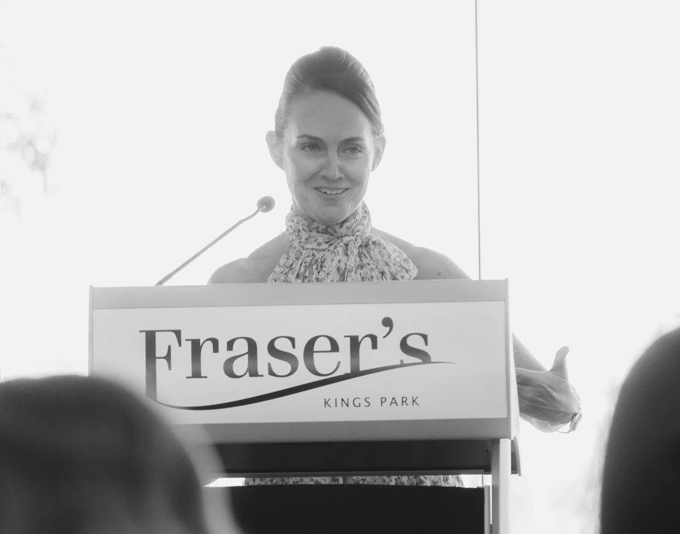 Dr Claire Donnellan speaking at a lectern in Kings Park, Perth